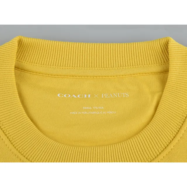 【COACH】COACH Peanuts Snoopy字母LOGO史努比躺在屋頂上棉圓領長袖T恤(女裝/萬壽菊黃)