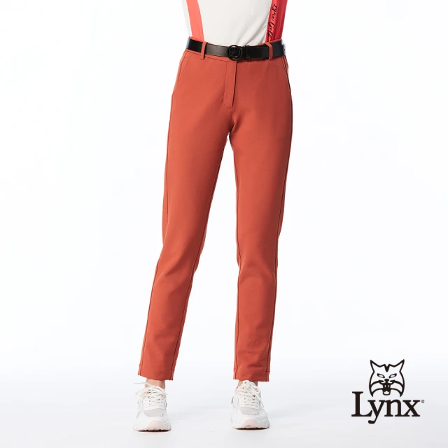 【Lynx Golf】女款日本進口布料彈性舒適素面脇邊剪裁造型窄管長褲(橘色)