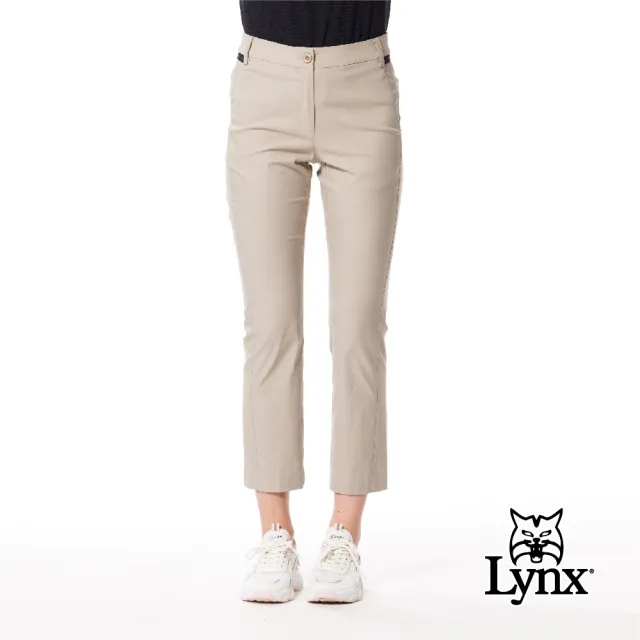 【Lynx Golf】女款彈性舒適後口袋繡花造型LOGO夜光織帶設計靴型九分褲(二色)
