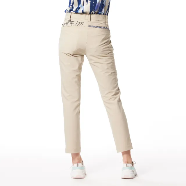 【Lynx Golf】女款日本進口布料抗UV接觸冷感機能織帶剪接設計草寫繡花造型窄管九分褲(卡其色)