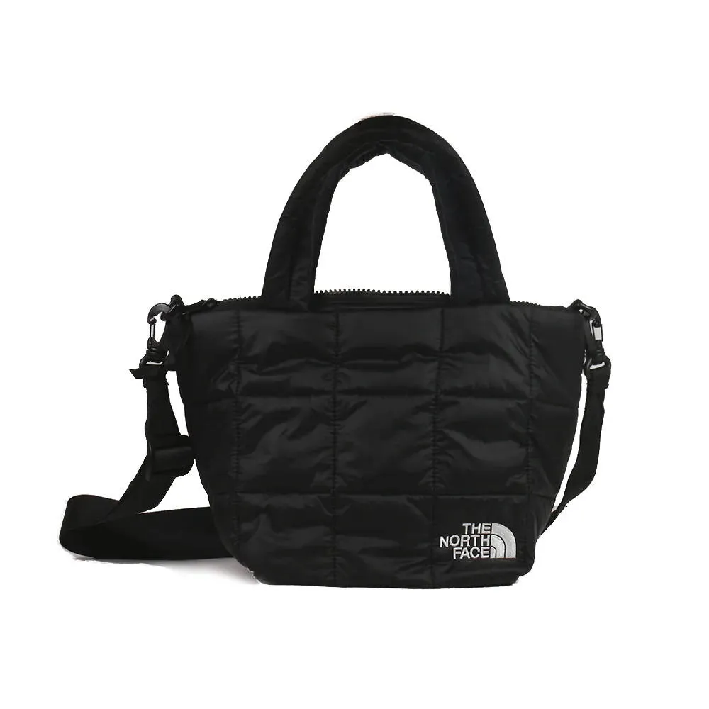 【The North Face】TNF 北臉 休閒 斜背包 手提包 NUPTSE MINI TOTE- AP 男 女 黑(NF0A8B20KX7)