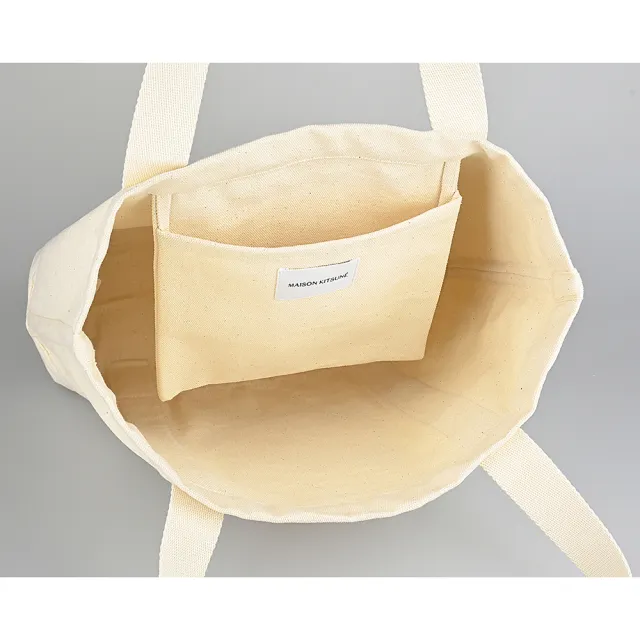 【Maison Kitsune】MAISON KITSUNE經典燙印LOGO大狐狸頭圖案設計帆布肩背托特包(自然米)