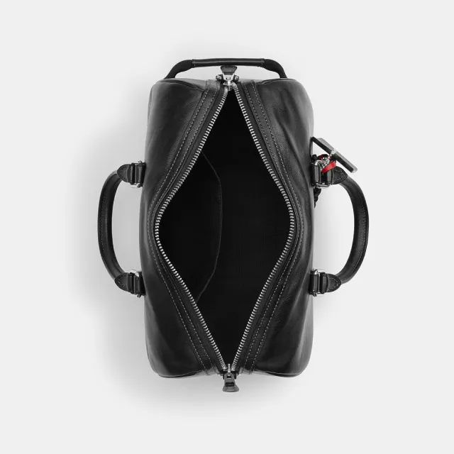 【COACH】蔻馳官方直營 VENTURER 27 掛件裝飾行李袋 旅行袋 斜背包-SV/黑色(CDY54)
