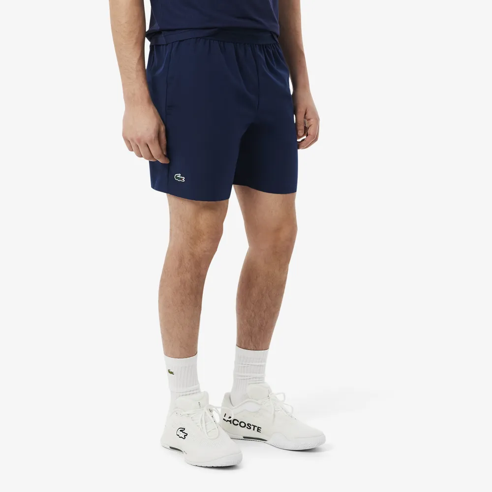 【LACOSTE】男裝-快乾透氣彈性網球短褲(海軍藍)