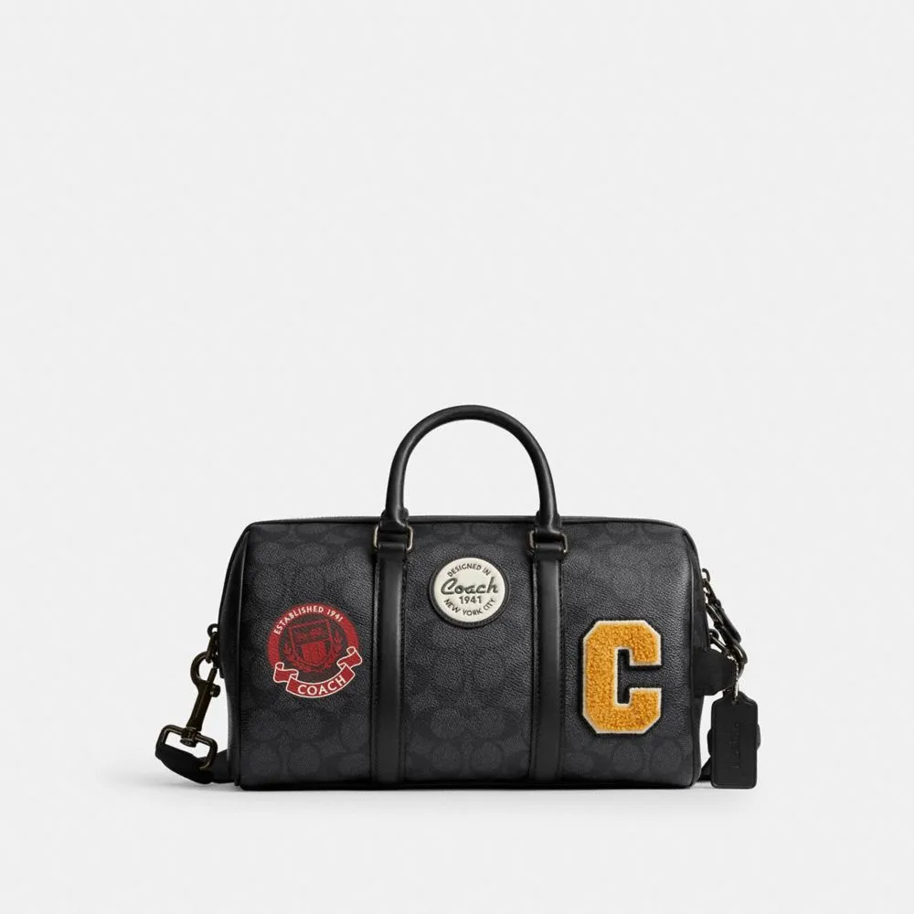 【COACH】蔻馳官方直營 VENTURER 27 經典 SIGNATURE 帆布與徽章旅行袋 旅行包 行李袋 斜背包-炭黑色(CY821)